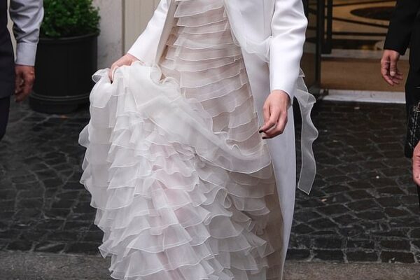 The dress code at Dior's annual cruise show was white for women, black for men and Natalie Portman glided in wearing a classic showstopper