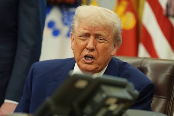 President Donald Trump speaks on the phone to Britain's Prime Minister Keir Starmer about a trade deal between the U.S. and United Kingdom in the Oval Office of the White House, Thursday, May 8, 2025, in Washington. (AP Photo/Evan Vucci)