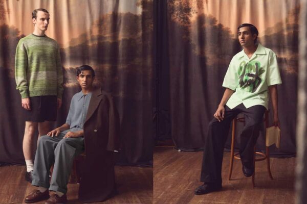 A split image shows a male model wearing a blue outfit sitting on a chair on the left, with another male model in a green jumper and black shorts standing next to him. On the right, a male model wearing a print-patterned shirt with dark trousers poses on a chair.