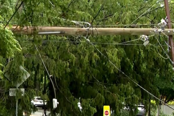 Storms knock out power across East Coast as heat wave builds