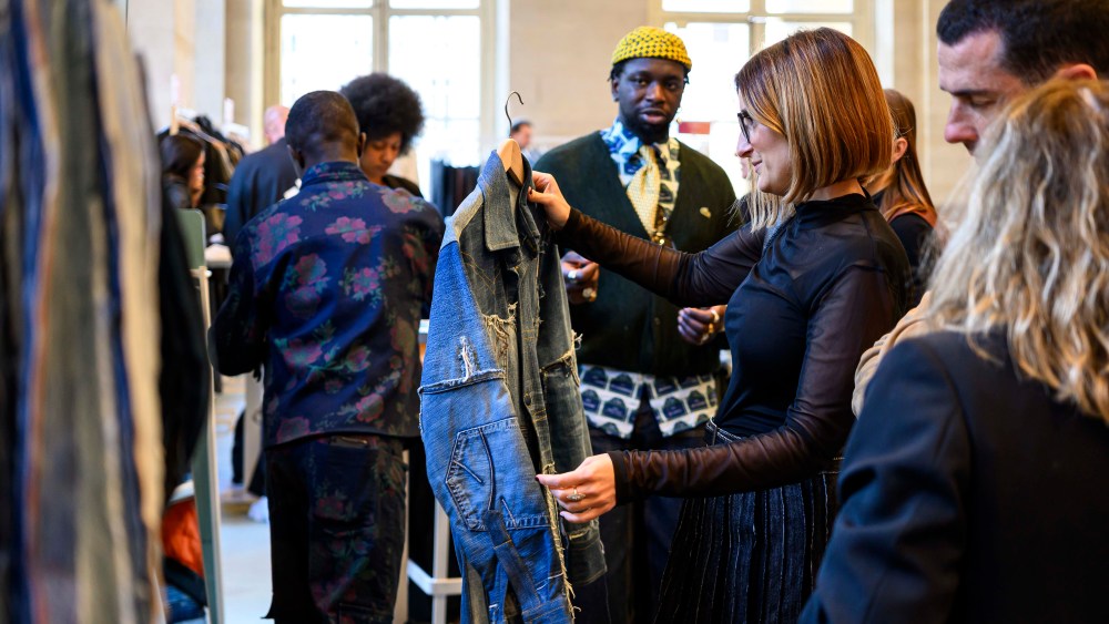 Visitors check out the Canex booth at the Tranoï trade show in Paris