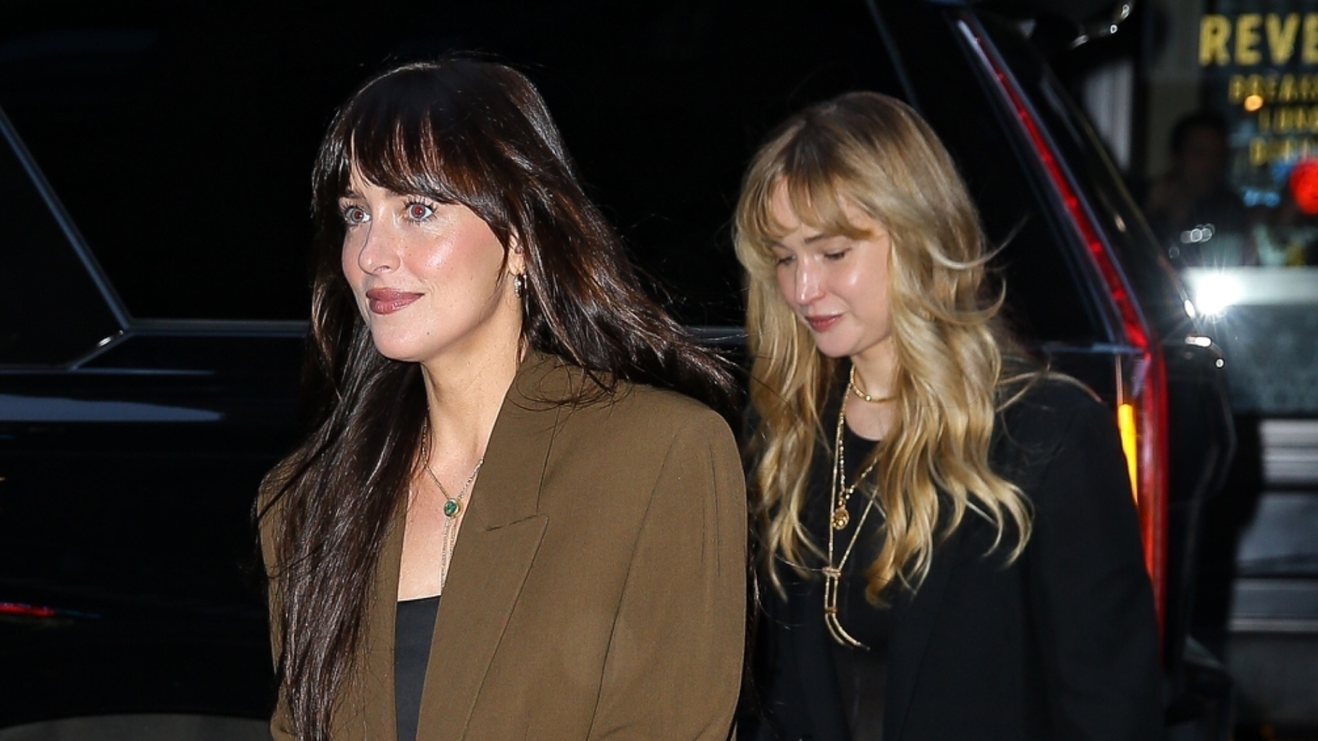 Dakota Johnson joins Jennifer Lawrence in New York with The Row bags in hand.