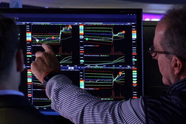 Wall St climbs after Fed's Bowman hints at rate cut; Tesla jumps