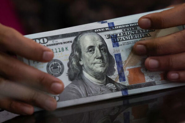 Dollar dips after jobs-fueled rally; US-China talks in focus
