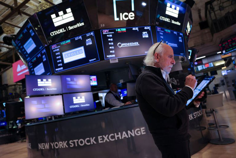 Shares hover near record highs, crude prices gain