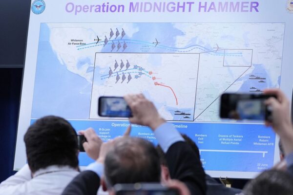 N.Y. leaders react with mixed messages to strikes on Iran Reporters take photos of a displayed graphic as Defense Secretary Pete Hegseth and Joint Chiefs Chairman Gen. Dan Caine speak during a news conference at the Pentagon in Washington, Sunday, June 22, 2025, after the U.S. military struck three sites in Iran, directly joining Israel's effort to destroy the country's nuclear program. (AP Photo/Alex Brandon)