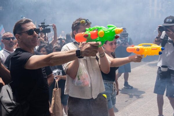 Some Spanish residents, armed with water guns, want tourists to go home Some Spanish residents, armed with water guns, want tourists to go home