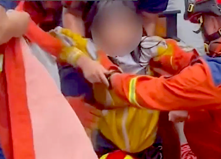 8-year-old survives 7 hours in sewer after China floods