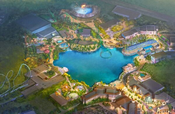 An artist's rendering of the Universal theme park near Bedford. The image shows a large, vibrant theme park with various attractions, including roller coasters, buildings and a central lake