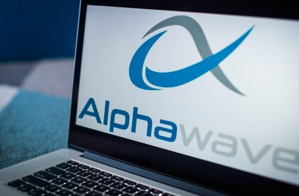 A laptop displaying the Alphawave logo