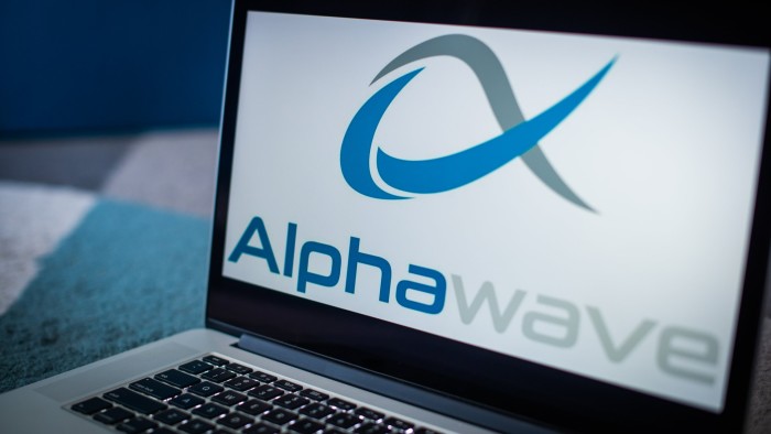 A laptop displaying the Alphawave logo