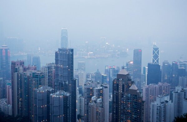High-rise residential and commercial buildings tower above Victoria Harbour in the Central district of Hong Kong