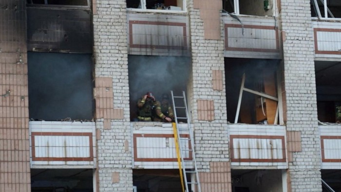 Firefighters working at a site of a Russian attack in the city of Smila, Cherkasy