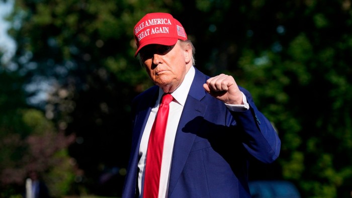 President Donald Trump walks on the South Lawn upon arriving at the White House