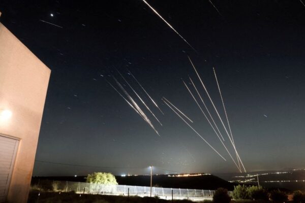 Iran fires missiles with cluster bombs as conflict with Israel enters day eight