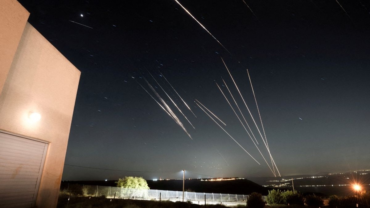 Iran fires missiles with cluster bombs as conflict with Israel enters day eight