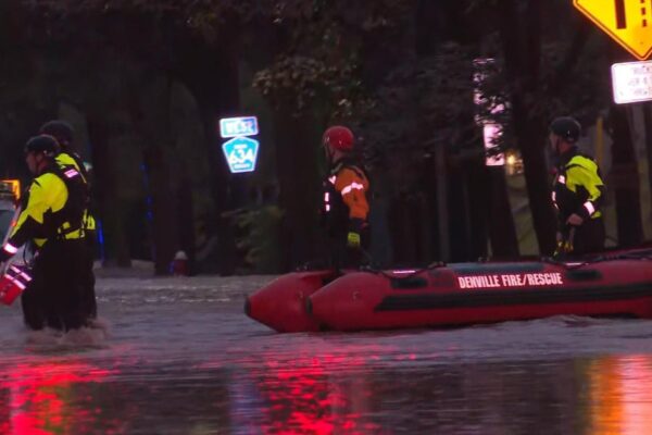 Video shows flood rescues, cars stranded as heavy rains slam Northeast