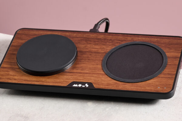 The Mous Charging Station with Qi2 sits at a slight angle on a light grey surface.