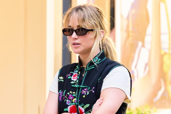 Jennifer Lawrence wore an embroidered vest with baggy jeans and Manolo Blahnik sandals