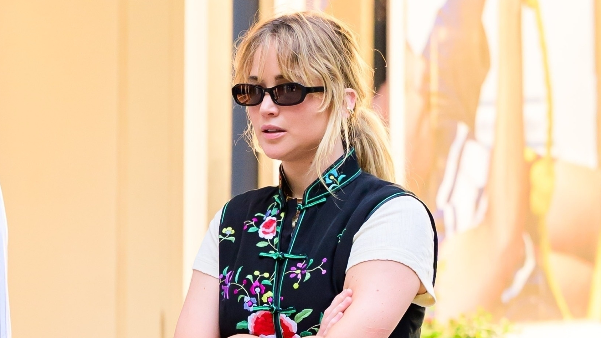 Jennifer Lawrence wore an embroidered vest with baggy jeans and Manolo Blahnik sandals