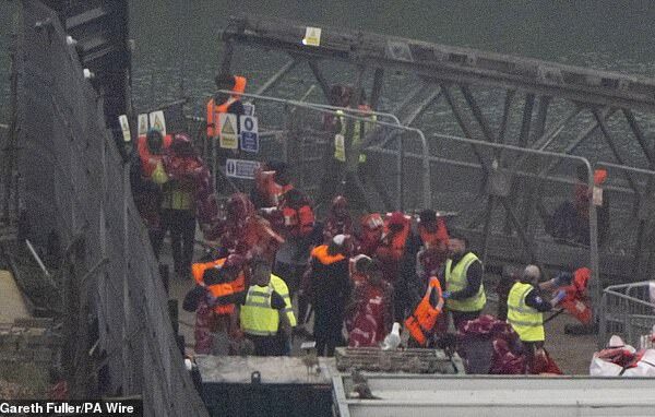 Channel migrants are 24 times more likely to be in prison than Brits, analysis by the Conservative party has revealed (Pictured: people thought to be migrants in Dover on Wednesday)