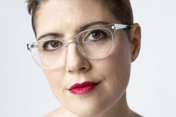 Christine Hunsicker Indicted in $300M Fashion Rental Fraud Case Christine Hunsicker wearing glasses and white top.