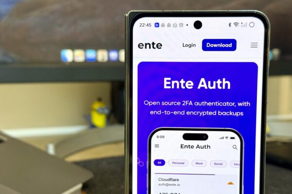 This is my favorite cross-platform 2FA app, and you should it try too Ente Auth on a phone with a monitor and laptop in the background