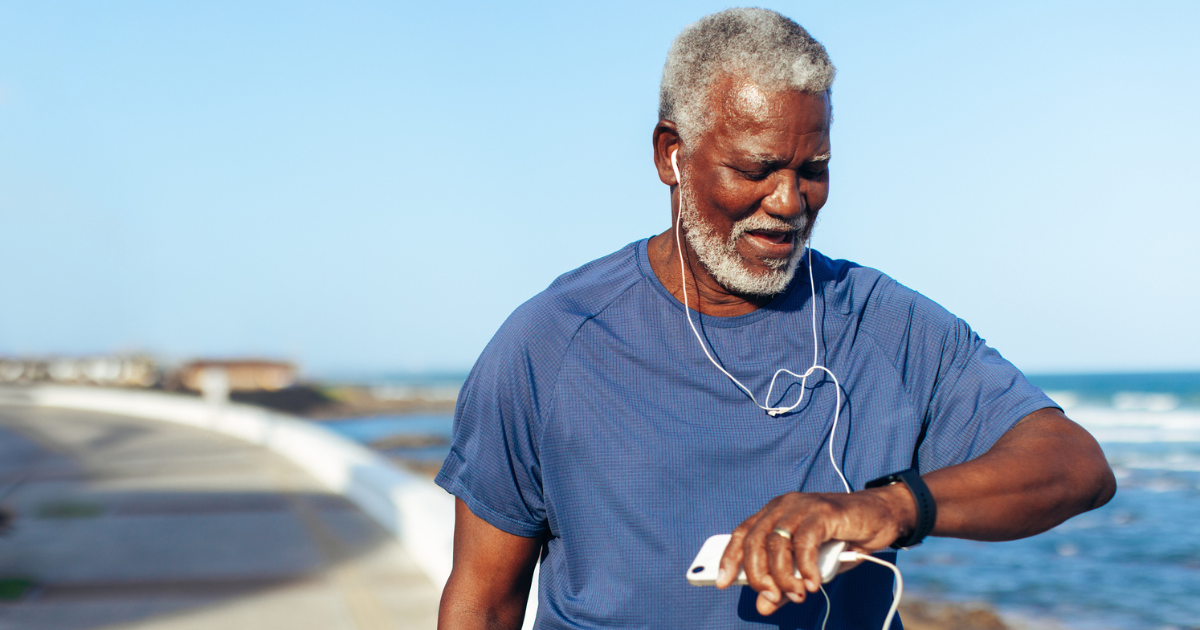 Older man looking at fitness tracker