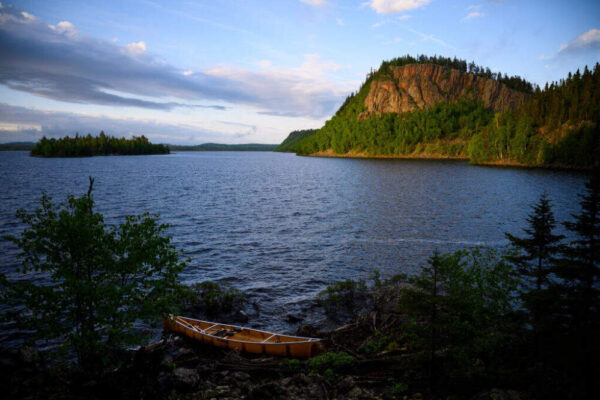 The sun illuminated a dramatic palisade on South Fowl Lake Friday night near the dam. Tony Jones, his 14-year old son Aidan, their friend Brad Shannon and Outdoors editor Bob Timmons embarked onto the Voyageurs Highway on Tuesday, June 11, 2019. (Aaron Lavinsky/Star Tribune via Getty Images)