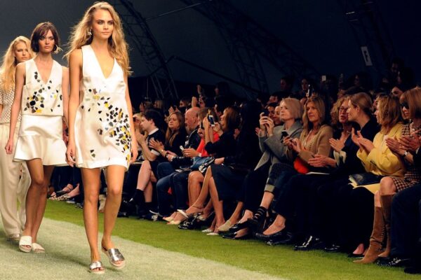 Topshop to Stage Fashion Show in London After Seven-year Hiatus LONDON, ENGLAND - SEPTEMBER 15: Cara Delevingne leads models down the runway at the Unique SS14 runway show during London Fashion Week on September 15, 2013 in London, England. (Photo by David M. Benett/Getty Images for Topshop Unique)