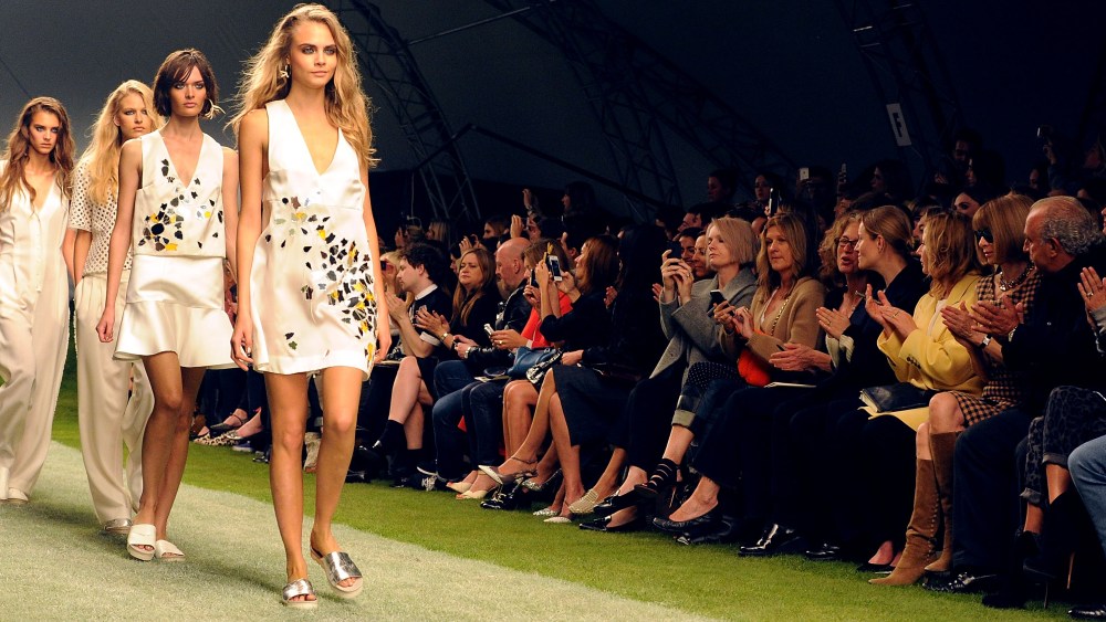 LONDON, ENGLAND - SEPTEMBER 15:  Cara Delevingne leads models down the runway at the Unique SS14 runway show during London Fashion Week on September 15, 2013 in London, England.  (Photo by David M. Benett/Getty Images for Topshop Unique)