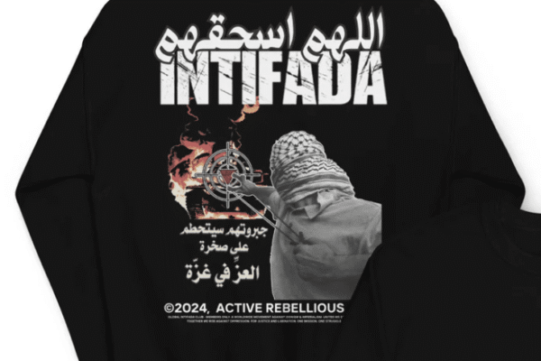 Black sweatshirt featuring the word “Intifada” in bold, Arabic script reading “O Allah, crush them,” an armed figure aiming at a target, and Arabic text referencing Gaza.