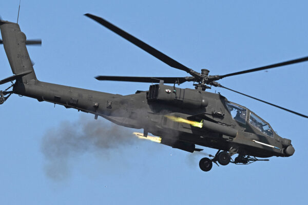 A South Korean AH-64 Apache helicopter fires rockets during a combined live-fire exercise between the South Korean and US armies at the Rodriguez Live Fire Complex in Pocheon on October 30, 2024. (Photo by Jung Yeon-je / AFP) (Photo by JUNG YEON-JE/AFP via Getty Images)