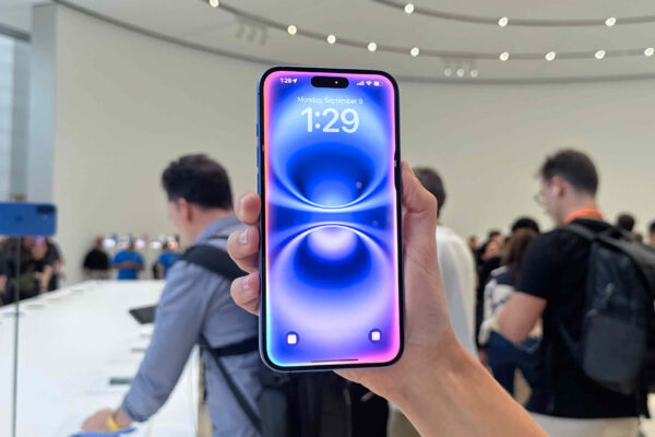 The iPhone 16 Plus being held