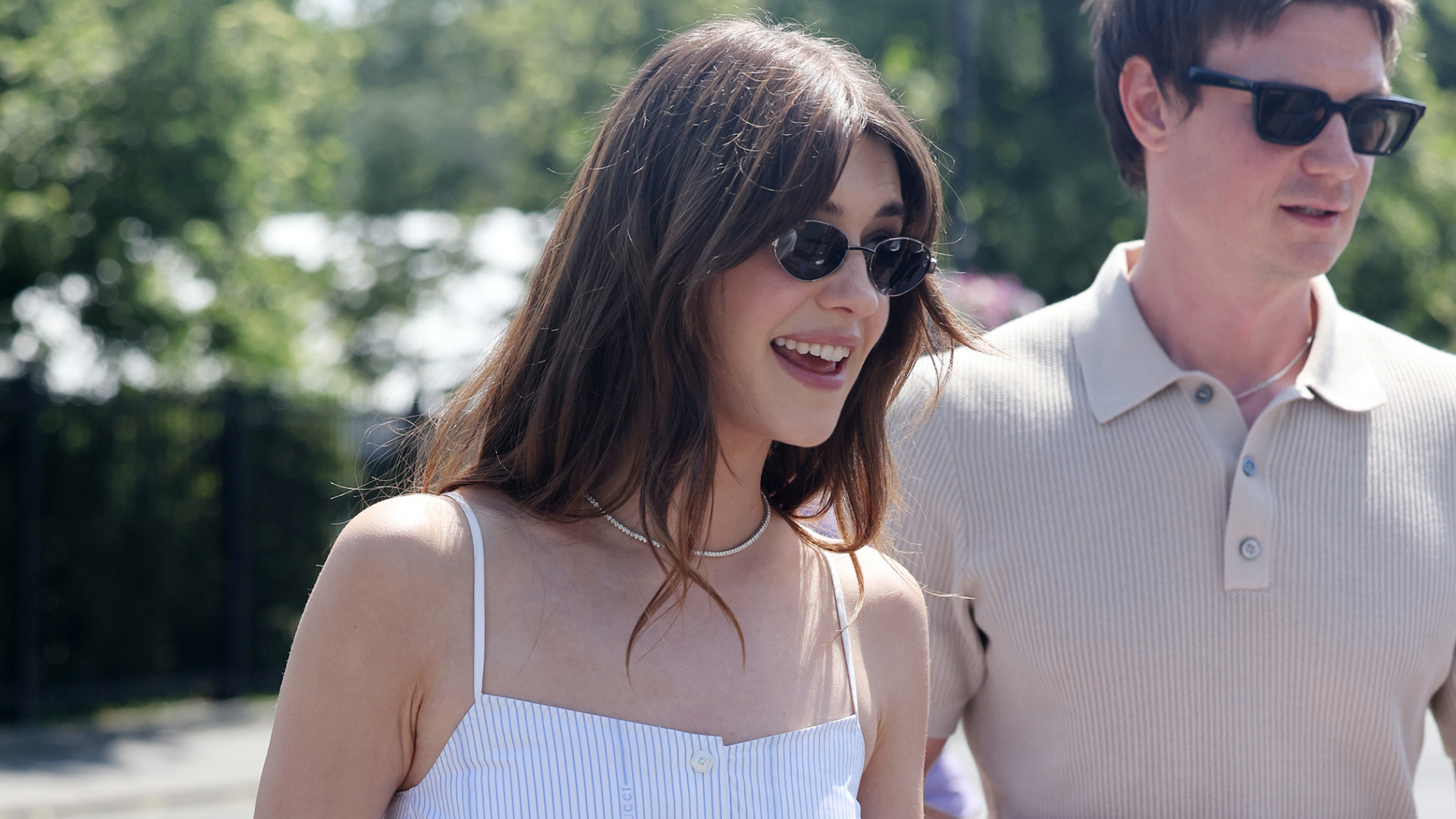 Daisy Edgar wears a matching linen set and carries a Gucci straw bag at Wimbledon