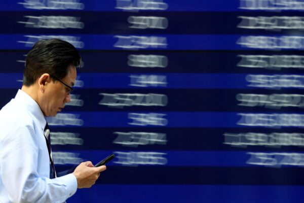Asian stocks slip from highs, dollar gains as markets brace for crucial week