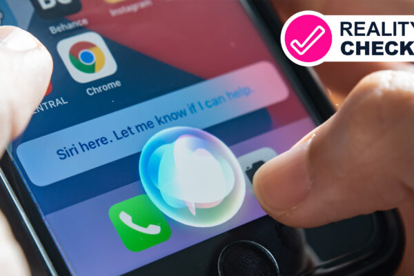Two hands holding an iPhone that shows the Siri voice assistant being activated
