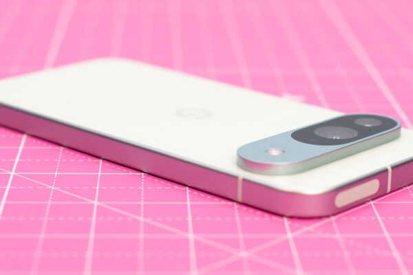 Google Pixel 9 in green Wintergreen color showing AI features on screen