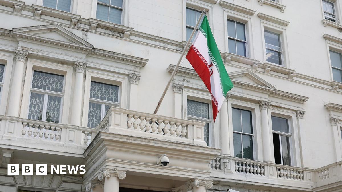 A flag flies in front of Iran's embassy, in London
