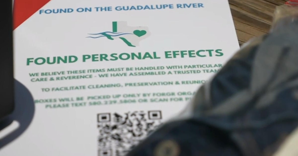 Volunteers gather personal items and mementos found along the river after Texas floods