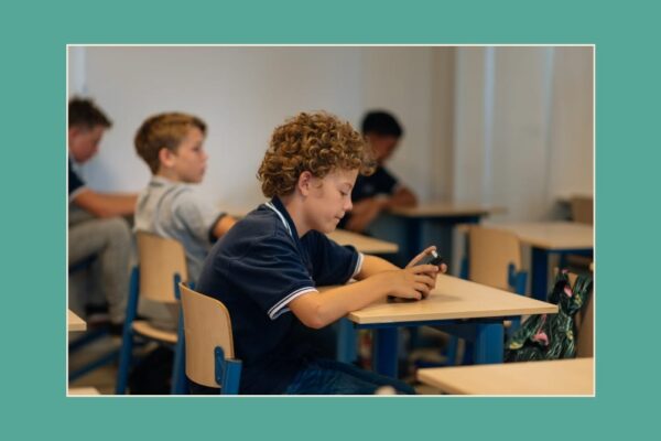 Call phone ban - a boy looking at a cell phone
