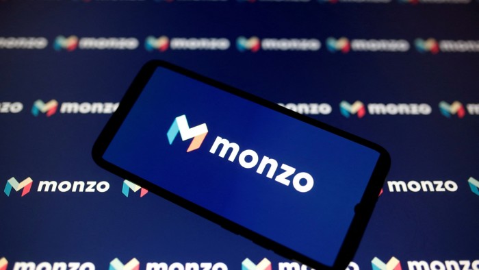 A smartphone displays a Monzo logo