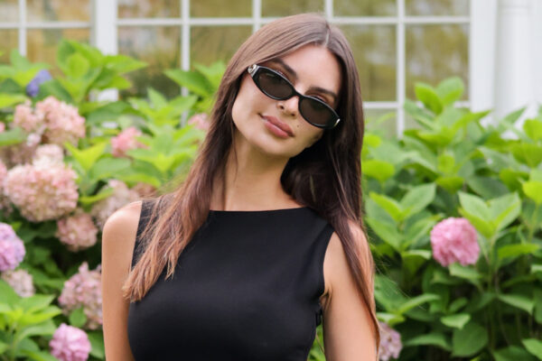 Emily Ratajkowski celebrates Gucci's GG monogram campaign in a little black dress with two Gucci Double-G bags