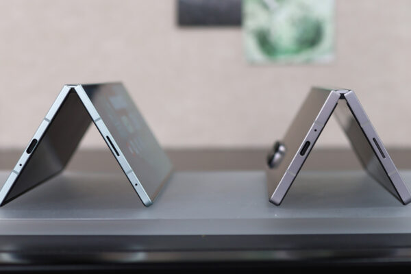 Samsung Galaxy Z Fold 7 next to the Z Fold 6, both bent in a V
