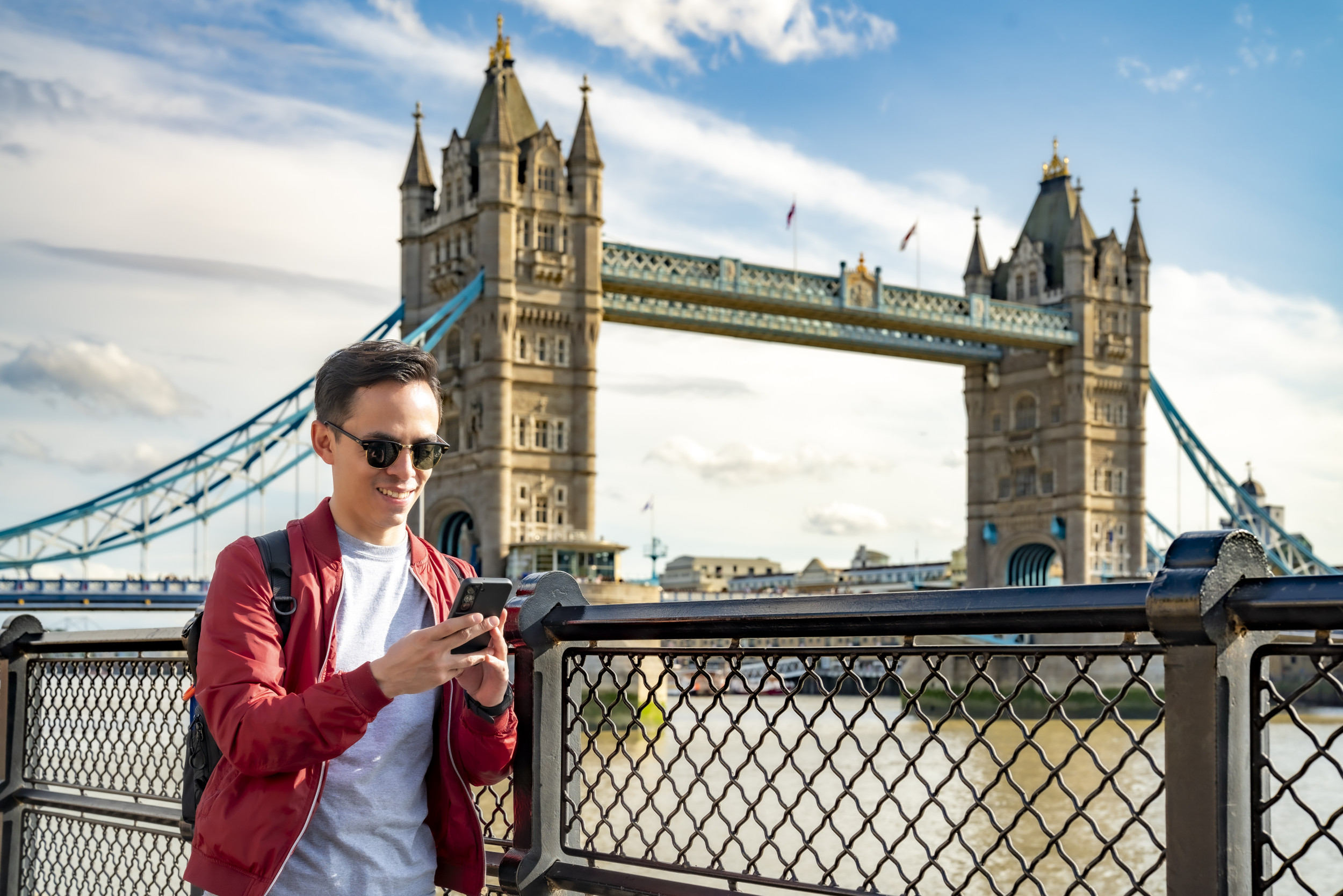 Tourist near Tower Bridge in London.