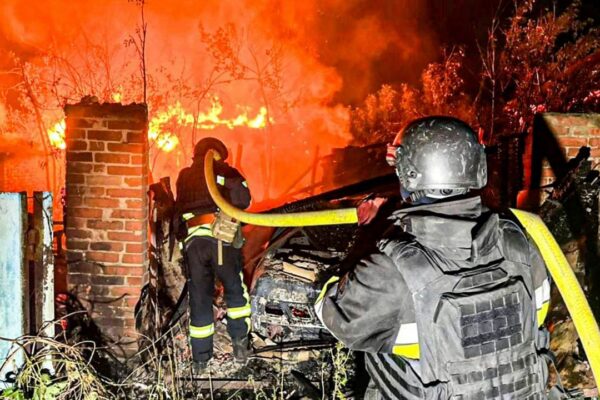 In this photo provided by the Ukrainian Emergency Service, firefighters try to put out a fire following a Russian attack in Kharkiv region, Ukraine, Tuesday, July 15, 2025. (Ukrainian Emergency Service via AP)