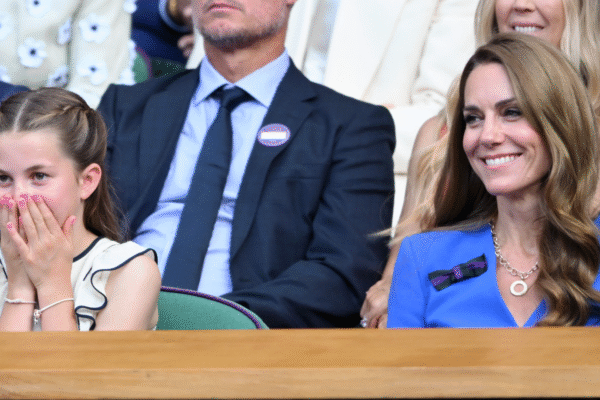 Princess Charlotte wearing pink nail polish at Wimbledon with her hands over her mouth
