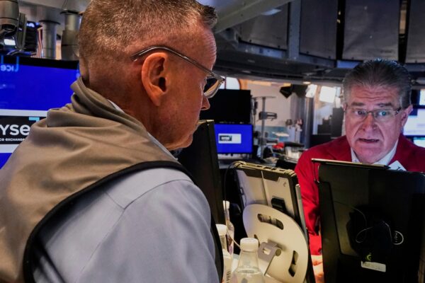 Wall Street dips in premarket but remains near record highs as another raft of earnings pours in