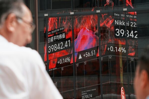 Asian shares are mixed as Trump’s tariff deadline looms, while US stocks set records