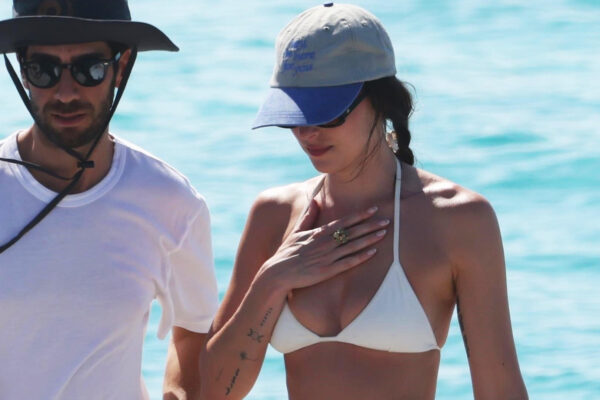 Dakota Johnson Sails to Ibiza in a Bikini, Dôen Skirt, and Gucci Bag